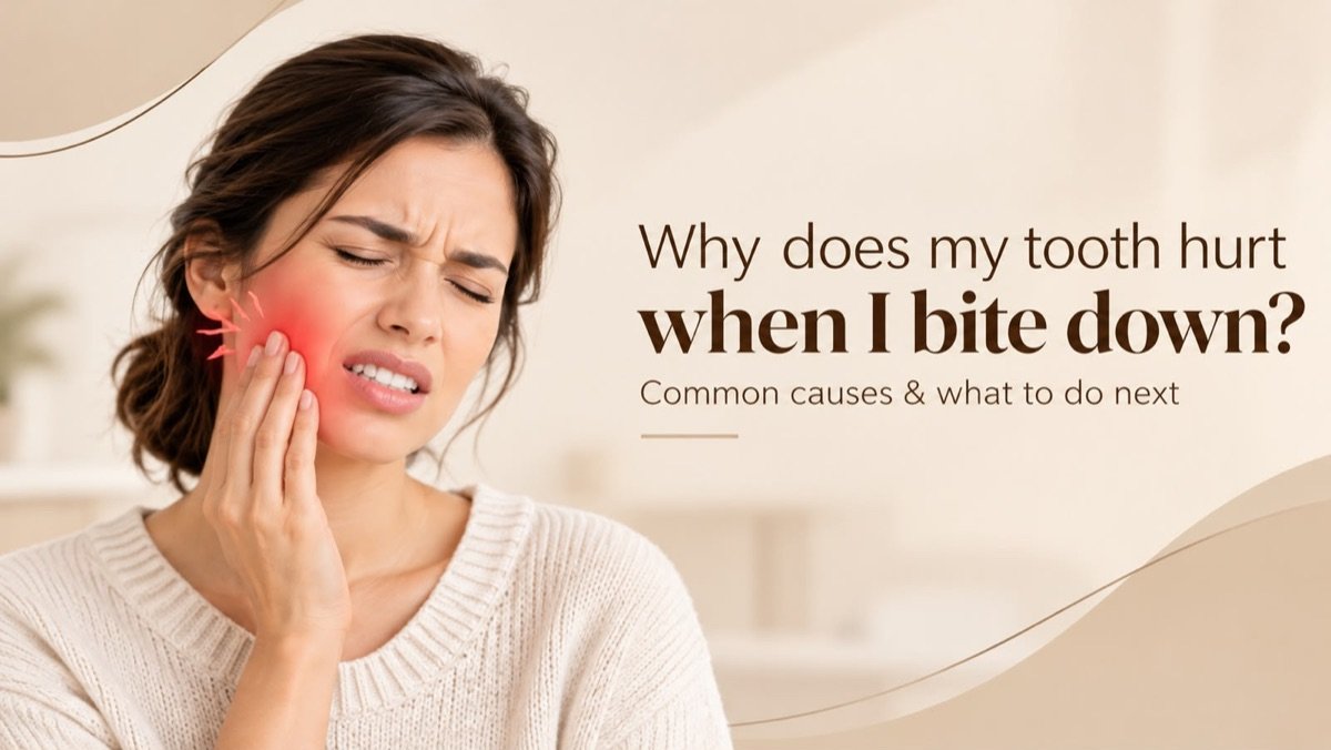 Woman wincing and holding her cheek because her tooth hurts when she bites down